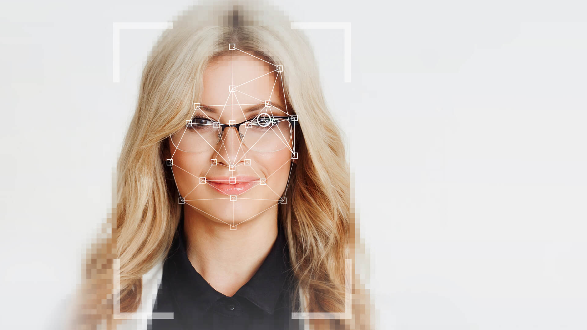 Blonde woman with glasses with tech style frame and lines mapping out her face